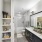 Luxury bathroom with built in shelving and large mirror